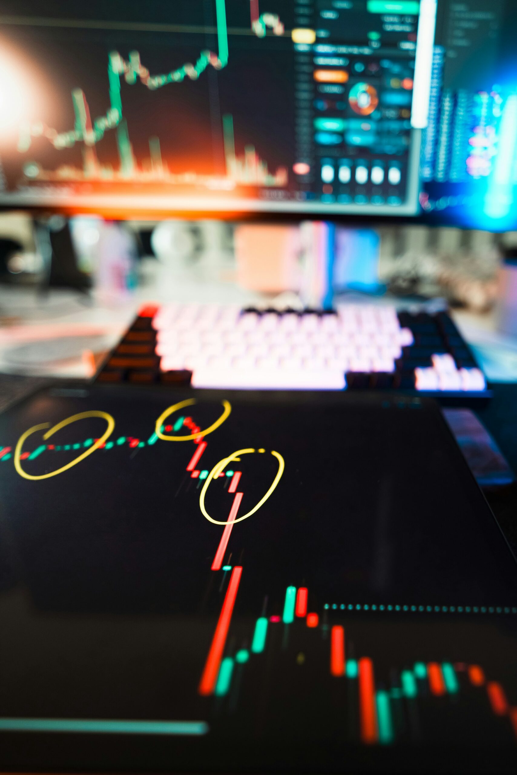 Computer workstation with multiple screens displaying graphs and data analytics, accompanied by a keyboard, representing a tech-forward CPA environment.. Photo by Jakub Żerdzicki on Unsplash